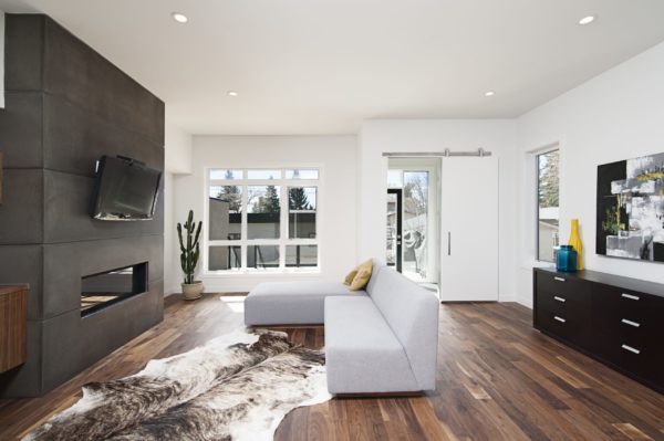 A beautiful interior shot of a modern house with white relaxing walls and furniture and technology